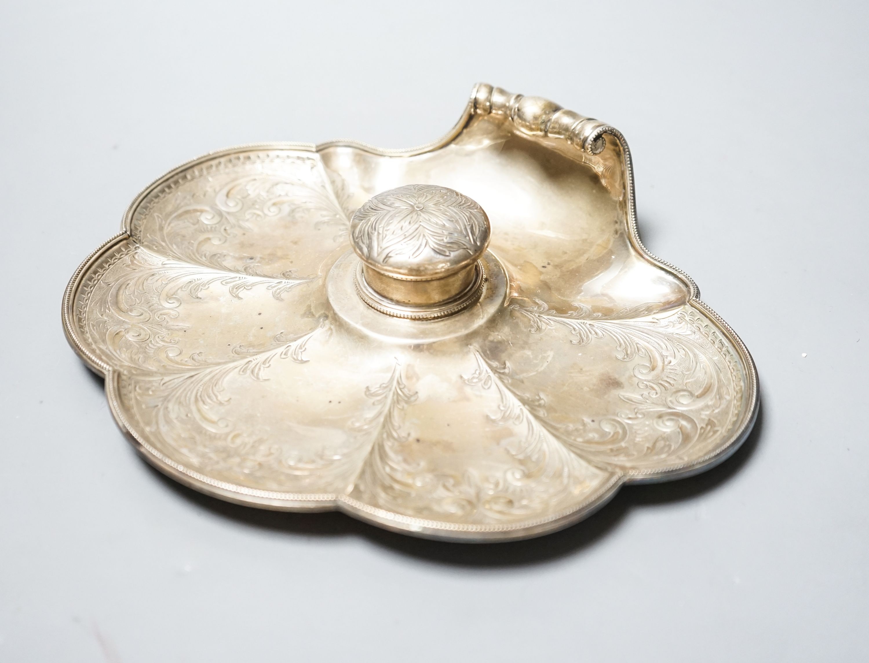 A late Victorian engraved silver shell shaped inkstand with single well, by Walker & Hall, Sheffield, 1897, 23.8cm, gross 14.5oz.